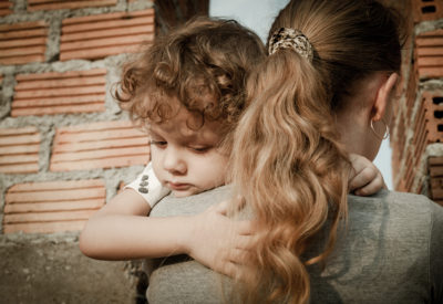 Woman hugging a young child