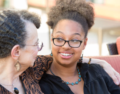 Two women smiling at each other Two women smiling at each other