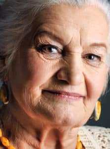 Elderly women looking directly into the camera