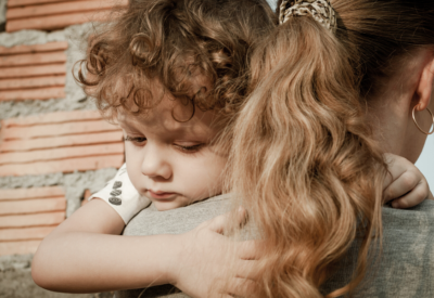 Woman hugging a young child