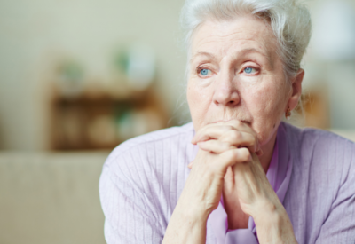 Older woman leaning on hands Older woman leaning on hands