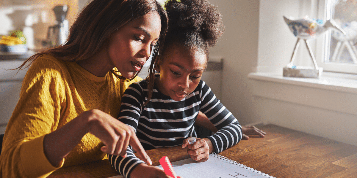 Mother and daughter drawing together