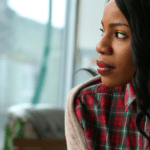 Image of woman looking out of a window