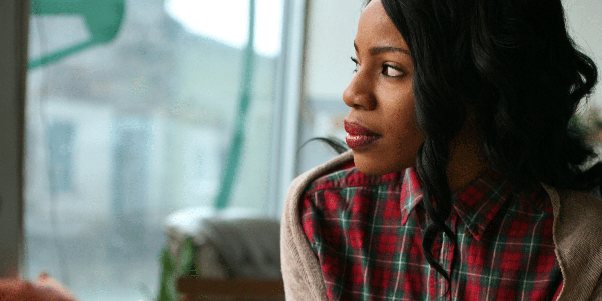Image of woman looking out of a window