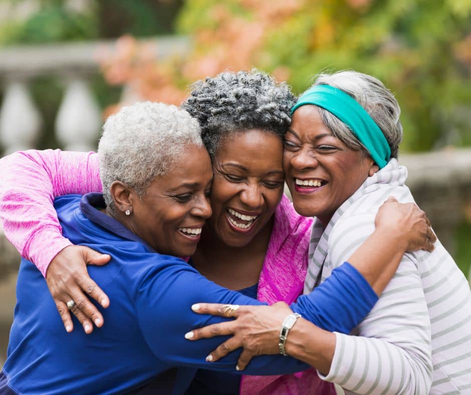 Three women hugging