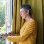 Woman looking out of window