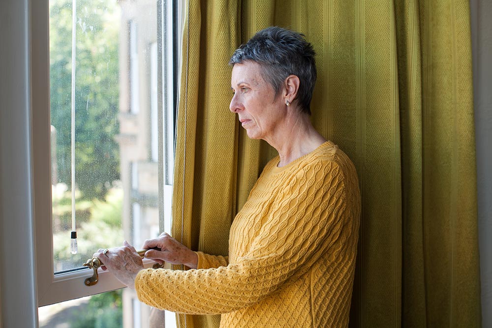 Woman looking out of window