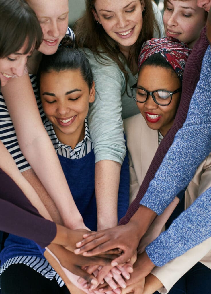 Women pledging hands