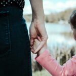 Mum holding child's hand